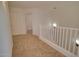 Upstairs hallway featuring carpeted floors, white walls and railing at 1789 E Desert Breeze Pl, Casa Grande, AZ 85122