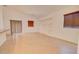Spacious living area with tile floors, built-in shelves, and window shutters at 1789 E Desert Breeze Pl, Casa Grande, AZ 85122