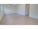 Sunlit living room with neutral tile flooring, white walls, and an open entrance at 1789 E Desert Breeze Pl, Casa Grande, AZ 85122