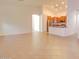 Open-concept living and dining area showcasing tile floors and a glimpse of the adjacent kitchen at 1789 E Desert Breeze Pl, Casa Grande, AZ 85122