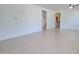 Bright, open-concept living area with tile flooring and staircase leading to the upper level at 1789 E Desert Breeze Pl, Casa Grande, AZ 85122