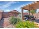 Backyard with outdoor grill and dining area at 18089 W Weatherby Dr, Surprise, AZ 85374