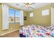 Comfortable bedroom with large window and natural light at 18089 W Weatherby Dr, Surprise, AZ 85374