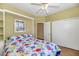 Cozy bedroom with built-in shelves and closet at 18089 W Weatherby Dr, Surprise, AZ 85374