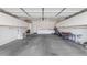 Large garage with storage cabinets providing ample space for parking and storage at 18089 W Weatherby Dr, Surprise, AZ 85374