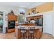 Beautiful kitchen with wooden cabinets, an island with seating, and stainless steel appliances, blending style and functionality at 18089 W Weatherby Dr, Surprise, AZ 85374