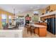 Open kitchen with an island, and a dining area, perfect for entertaining at 18089 W Weatherby Dr, Surprise, AZ 85374