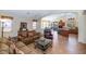 Spacious living room featuring tile floors, neutral paint, and modern lighting creating a bright atmosphere at 18089 W Weatherby Dr, Surprise, AZ 85374