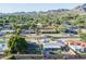 An aerial view of a residential lot with mature landscaping and neighborhood surroundings at 1909 E Bethany Home Rd, Phoenix, AZ 85016