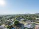 Aerial view of the residential lot and the surrounding community with mountain views at 1909 E Bethany Home Rd, Phoenix, AZ 85016
