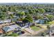 Aerial view of the residential home with a backyard, carport, and a palm tree at 1909 E Bethany Home Rd, Phoenix, AZ 85016