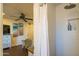 Bathroom includes a shower with tiled walls, a recessed niche, and a glimpse into the bedroom at 1909 E Bethany Home Rd, Phoenix, AZ 85016