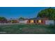 Charming brick home featuring a well-maintained lawn, large shade tree and updated windows at 1909 E Bethany Home Rd, Phoenix, AZ 85016