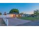 Charming single-story home featuring a brick facade, a spacious driveway, and a well-maintained front yard at 1909 E Bethany Home Rd, Phoenix, AZ 85016