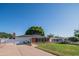 Charming single-story home with a well-maintained front yard, brick facade, and inviting entrance at 1909 E Bethany Home Rd, Phoenix, AZ 85016