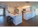 Bright, open kitchen with stainless appliances, white cabinets, and modern countertops at 1909 E Bethany Home Rd, Phoenix, AZ 85016