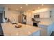 The bright kitchen boasts quartz countertops, stainless steel appliances, and an open concept design at 1909 E Bethany Home Rd, Phoenix, AZ 85016