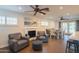 Open living space showcasing a fireplace, comfortable seating, and a dining area near the kitchen at 1909 E Bethany Home Rd, Phoenix, AZ 85016