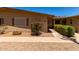 Charming home featuring a well-maintained walkway and beautiful desert landscaping at 19685 N Star Ridge Dr, Sun City West, AZ 85375