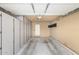 Spacious two-car garage with ample storage cabinets at 19685 N Star Ridge Dr, Sun City West, AZ 85375