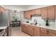 Modern kitchen features stainless steel appliances, breakfast bar, and plenty of cabinet space at 19685 N Star Ridge Dr, Sun City West, AZ 85375