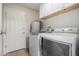 Laundry room features front load washer and dryer at 19685 N Star Ridge Dr, Sun City West, AZ 85375