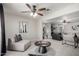 Open living space boasts comfortable seating and modern artwork, perfect for relaxation at 19685 N Star Ridge Dr, Sun City West, AZ 85375