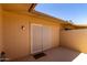 View of covered back patio featuring neutral paint, concrete and sliding glass door at 19685 N Star Ridge Dr, Sun City West, AZ 85375
