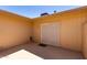 Covered back patio featuring neutral paint, concrete and sliding glass door at 19685 N Star Ridge Dr, Sun City West, AZ 85375
