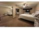 Spacious bedroom features a ceiling fan and mirrored closet doors at 19943 N 77Th Ave, Glendale, AZ 85308