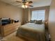 Bedroom features carpeted floors, ceiling fan, and window with blinds at 19943 N 77Th Ave, Glendale, AZ 85308