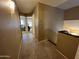 Hallway with neutral paint leading to multiple rooms at 19943 N 77Th Ave, Glendale, AZ 85308