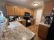 Functional kitchen with wooden cabinets, modern appliances, and durable laminate countertops at 19943 N 77Th Ave, Glendale, AZ 85308