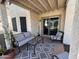 Covered patio with comfortable seating and patterned rug at 19943 N 77Th Ave, Glendale, AZ 85308