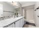 Clean bathroom featuring a granite vanity, white cabinets, and a shower at 2019 W Lemon Tree Pl # 1185, Chandler, AZ 85224