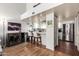 Modern kitchen area with stainless steel refrigerator, granite countertops, and breakfast bar with seating at 2019 W Lemon Tree Pl # 1185, Chandler, AZ 85224