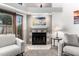 Comfortable living room showcasing a fireplace and access to backyard at 2019 W Lemon Tree Pl # 1185, Chandler, AZ 85224