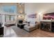 Bright living room with high ceilings, fireplace, and cozy gray sofa at 2019 W Lemon Tree Pl # 1185, Chandler, AZ 85224