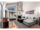 Bright living room with vaulted ceilings, fireplace, and large windows offering plenty of natural light at 2019 W Lemon Tree Pl # 1185, Chandler, AZ 85224