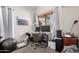 Home office space with a large window, desk setup, and neutral color scheme at 2019 W Lemon Tree Pl # 1185, Chandler, AZ 85224