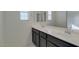 Bright bathroom featuring dual sinks, a large mirror, and ample counter space with modern fixtures at 2254 E University Dr # 4, Mesa, AZ 85213