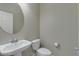 Clean bathroom with toilet and pedestal sink, offering a functional and minimalist design at 2254 E University Dr # 4, Mesa, AZ 85213