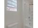 Bright bathroom featuring a shower-tub combo with a rainfall shower head and white subway tile at 2254 E University Dr # 4, Mesa, AZ 85213