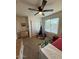 Bright bedroom with ceiling fan, neutral walls, and comfortable decor at 2254 E University Dr # 4, Mesa, AZ 85213
