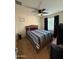 Cozy bedroom with a comfy bed, ceiling fan, and neutral walls at 2254 E University Dr # 4, Mesa, AZ 85213
