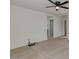 Bright, empty bedroom area with a ceiling fan and neutral carpeting at 2254 E University Dr # 4, Mesa, AZ 85213