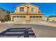 Inviting two-story home featuring a two-car garage, classic shutters, and charming curb appeal at 2254 E University Dr # 4, Mesa, AZ 85213