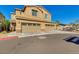 Inviting two-story home featuring a two-car garage and charming curb appeal with desert landscaping at 2254 E University Dr # 4, Mesa, AZ 85213
