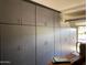 Garage with ample storage space provided by built-in gray cabinets at 2254 E University Dr # 4, Mesa, AZ 85213
