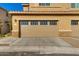Spacious two-car garage with brick accents and a well-maintained driveway at 2254 E University Dr # 4, Mesa, AZ 85213